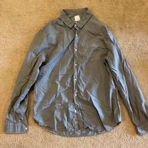 Grey button down shirt.